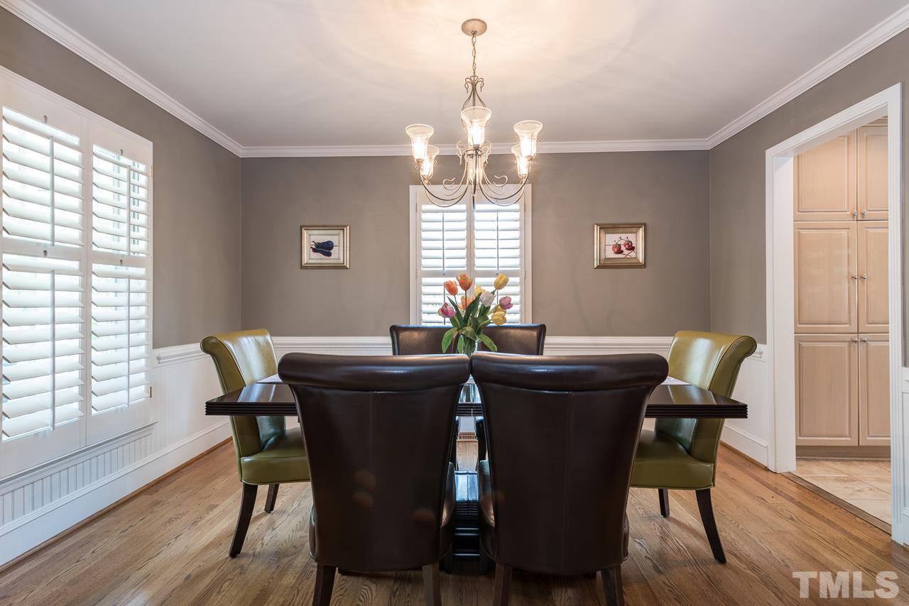 2320 Ridge Road Raleigh, NC 27612 - Photo 5 of 25 a view of a dining room with furniture window and wooden floor