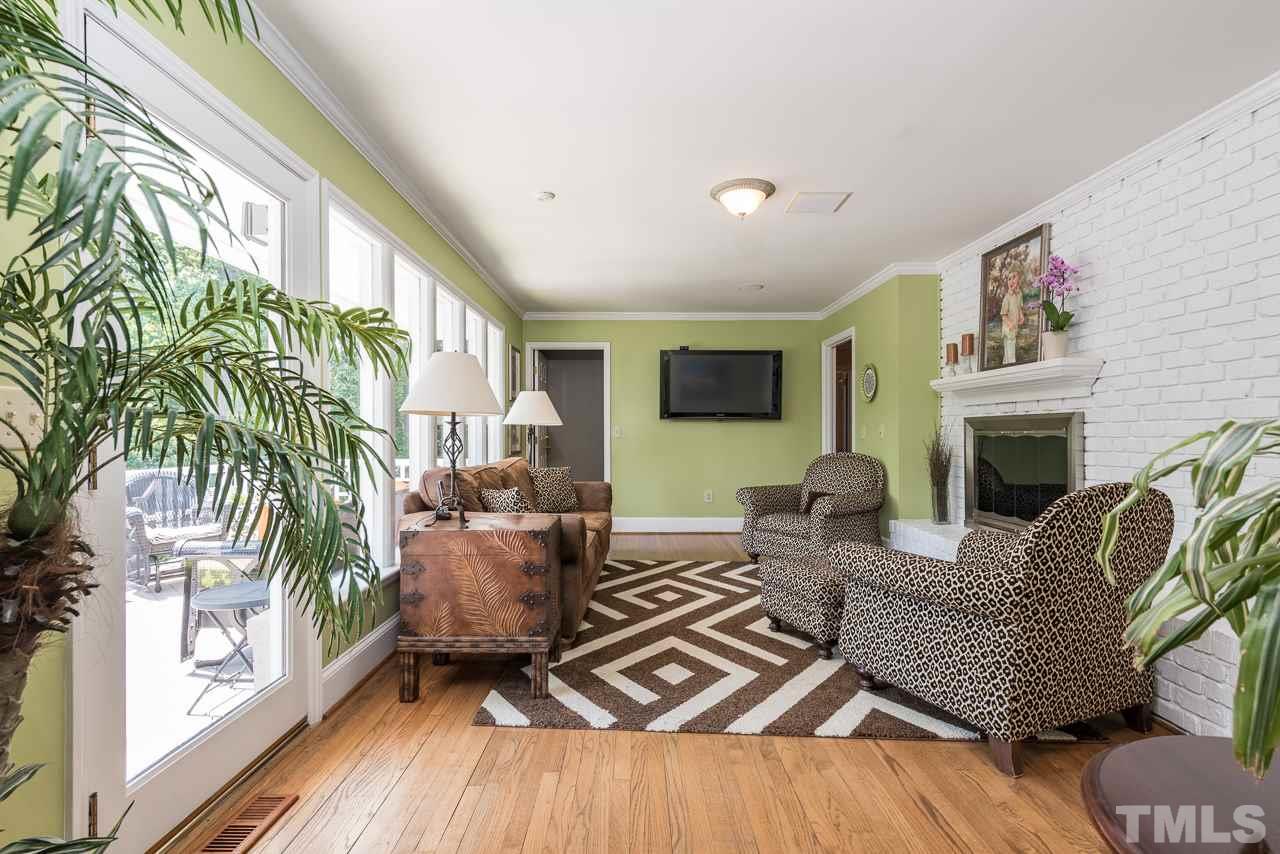 2320 Ridge Road Raleigh, NC 27612 - Photo 8 of 25 a living room with furniture and a fireplace