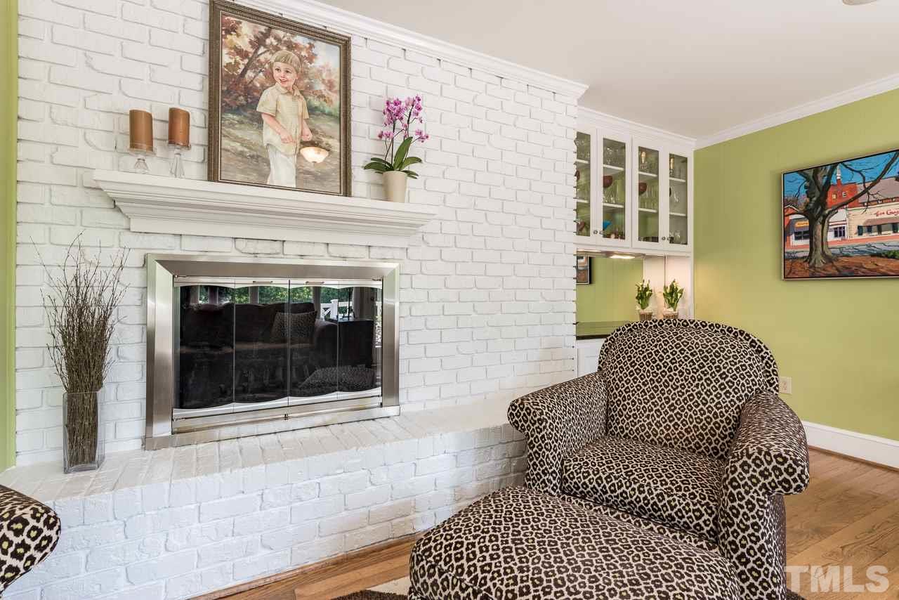 2320 Ridge Road Raleigh, NC 27612 - Photo 9 of 25 a living room with furniture and a fireplace