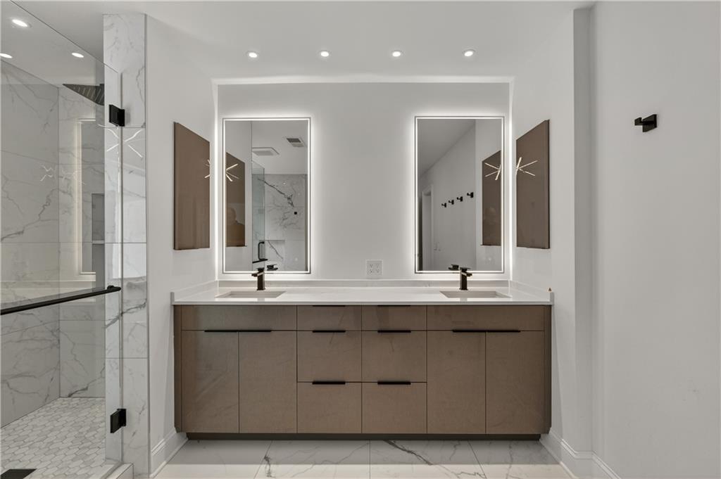 4610 West Morton Road Alpharetta, GA 30022 - Photo 32 of 53 a bathroom with a double vanity sink mirror and double