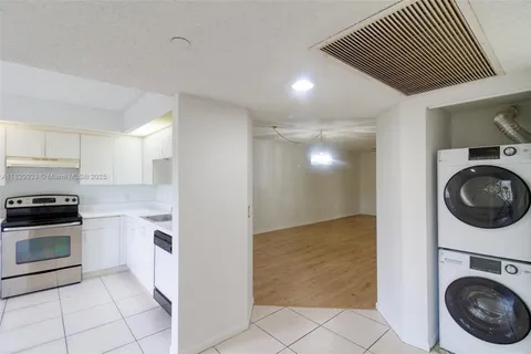 a view of a kitchen with washer and dryer