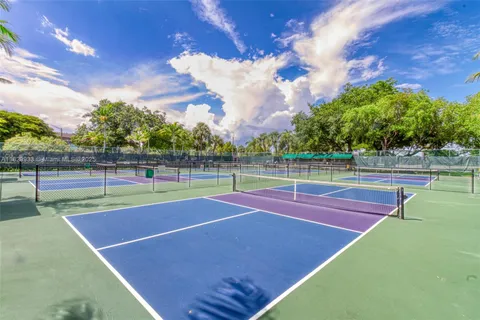 a view of an outdoor space and tennis court