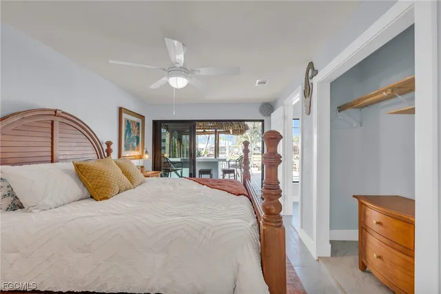 a bedroom with a large bed and a dresser