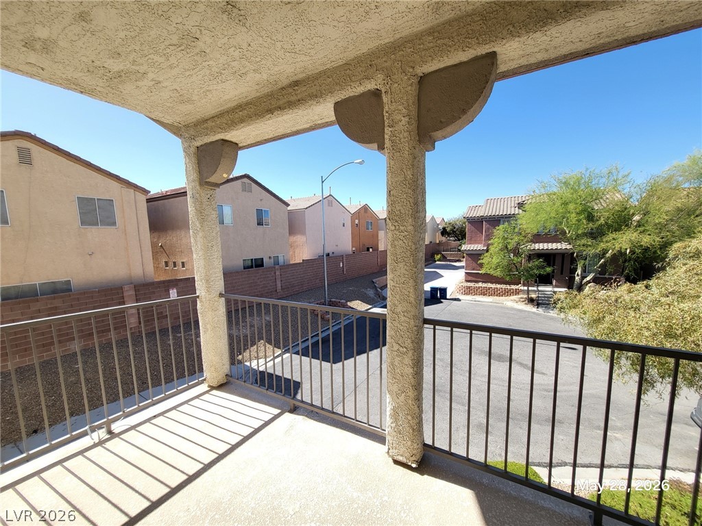 9843 West Overlook Ridge Avenue Las Vegas, NV 89148 - Photo 18 of 19 An inviting private balcony offers a vantage point of the neighborhood and surrounding structures.