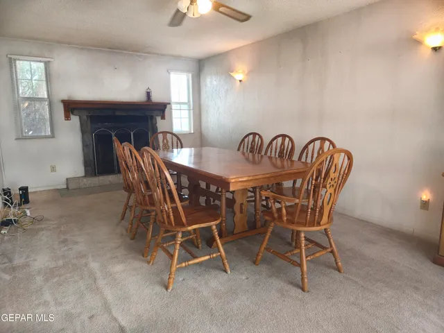 a dining room with furniture and window