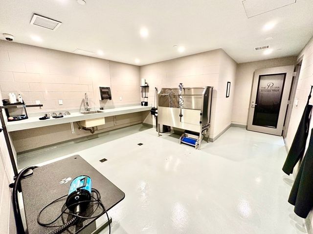 a living room with furniture and white walls