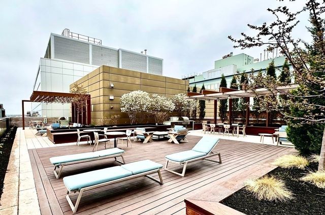 a outdoor space with patio couch and a potted plant