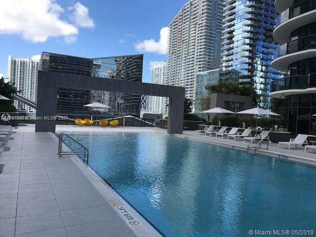 55 Southwest 9th Street, Unit 2510 Miami, FL 33130 - Photo 14 of 27 a view of a swimming pool with outdoor seating