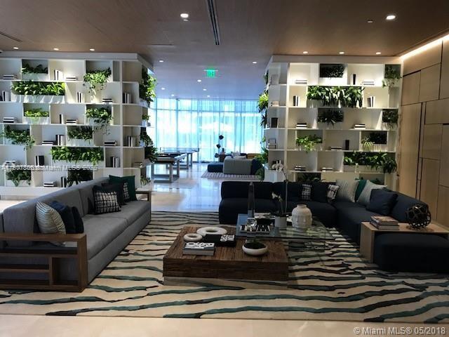 55 Southwest 9th Street, Unit 2510 Miami, FL 33130 - Photo 23 of 27 a living room with lots of furniture and kitchen view