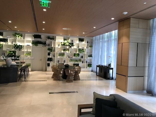 55 Southwest 9th Street, Unit 2510 Miami, FL 33130 - Photo 24 of 27 a living room with couches and kitchen view