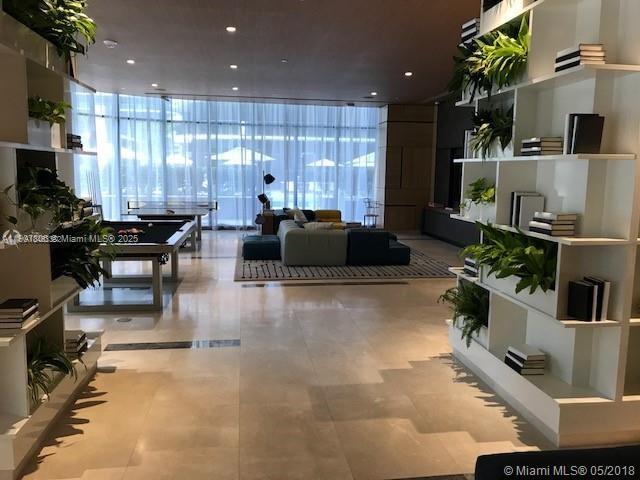 55 Southwest 9th Street, Unit 2510 Miami, FL 33130 - Photo 25 of 27 a living room with furniture and a large window