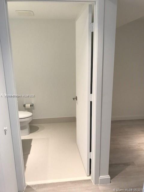 55 Southwest 9th Street, Unit 2510 Miami, FL 33130 - Photo 7 of 27 view of bathroom with a toilet