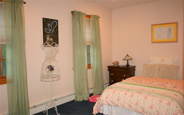 25 Polly Road Holland, MA 01521 - Photo 23 of 30 a bedroom with a bed and a mirror