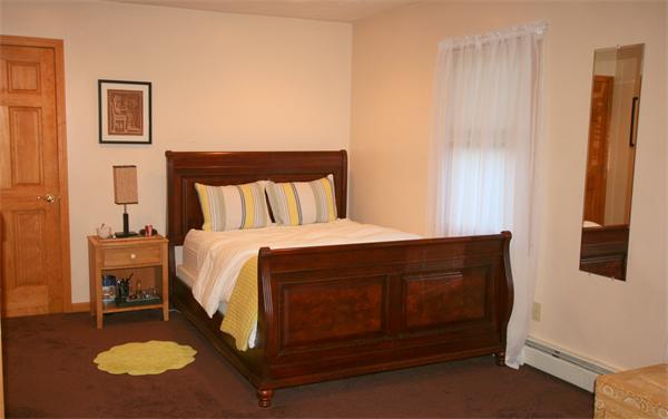 25 Polly Road Holland, MA 01521 - Photo 25 of 30 a spacious bedroom with a bed and a lamp