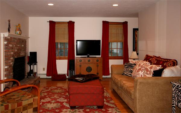 25 Polly Road Holland, MA 01521 - Photo 6 of 30 a living room with furniture a flat screen tv and a fireplace