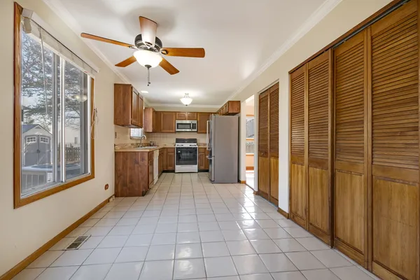 a view of a kitchen with a stove cabinets and a kitchen