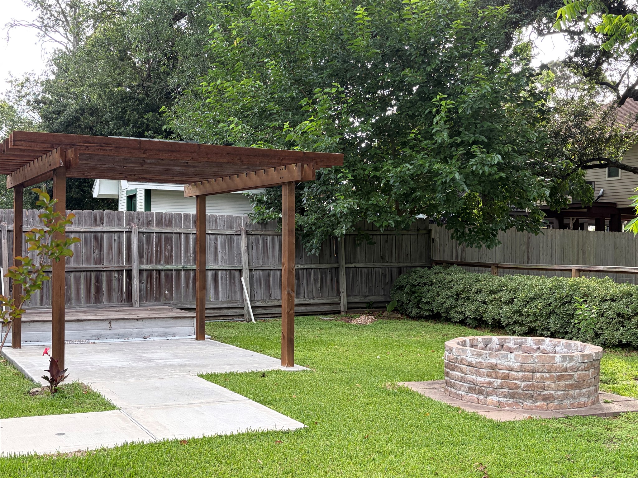 1206 4th Street Seabrook, TX 77586 - Photo 9 of 9 Back yard with fire pit and pergola