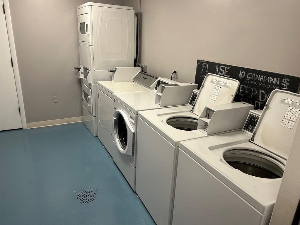 5 Turnpike Road, Unit 233 Townsend, MA 01469 - Photo 4 of 16 a utility room with dryer and washer