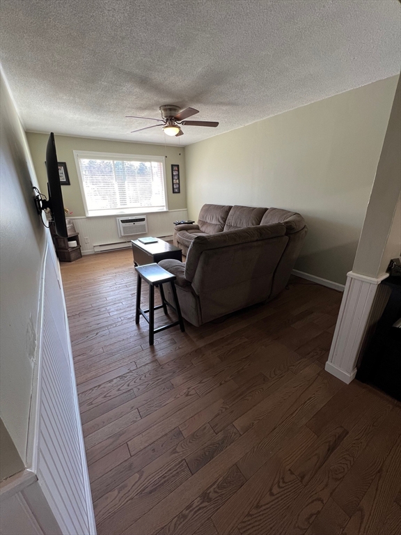 5 Turnpike Road, Unit 233 Townsend, MA 01469 - Photo 8 of 16 a living room with furniture and a wooden floor