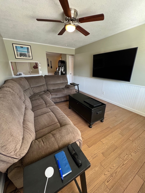 5 Turnpike Road, Unit 233 Townsend, MA 01469 - Photo 10 of 16 a living room with furniture and a flat screen tv