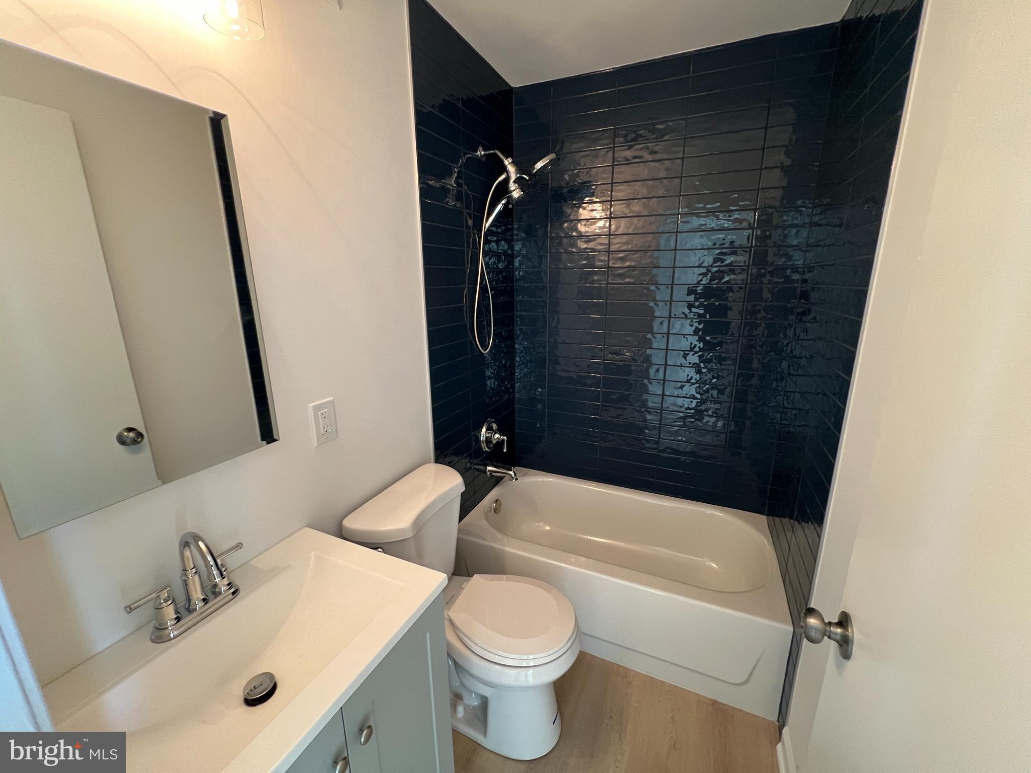 626 South 8th Street, Unit 2 Philadelphia, PA 19147 - Photo 11 of 14 a bathroom with a sink toilet and shower