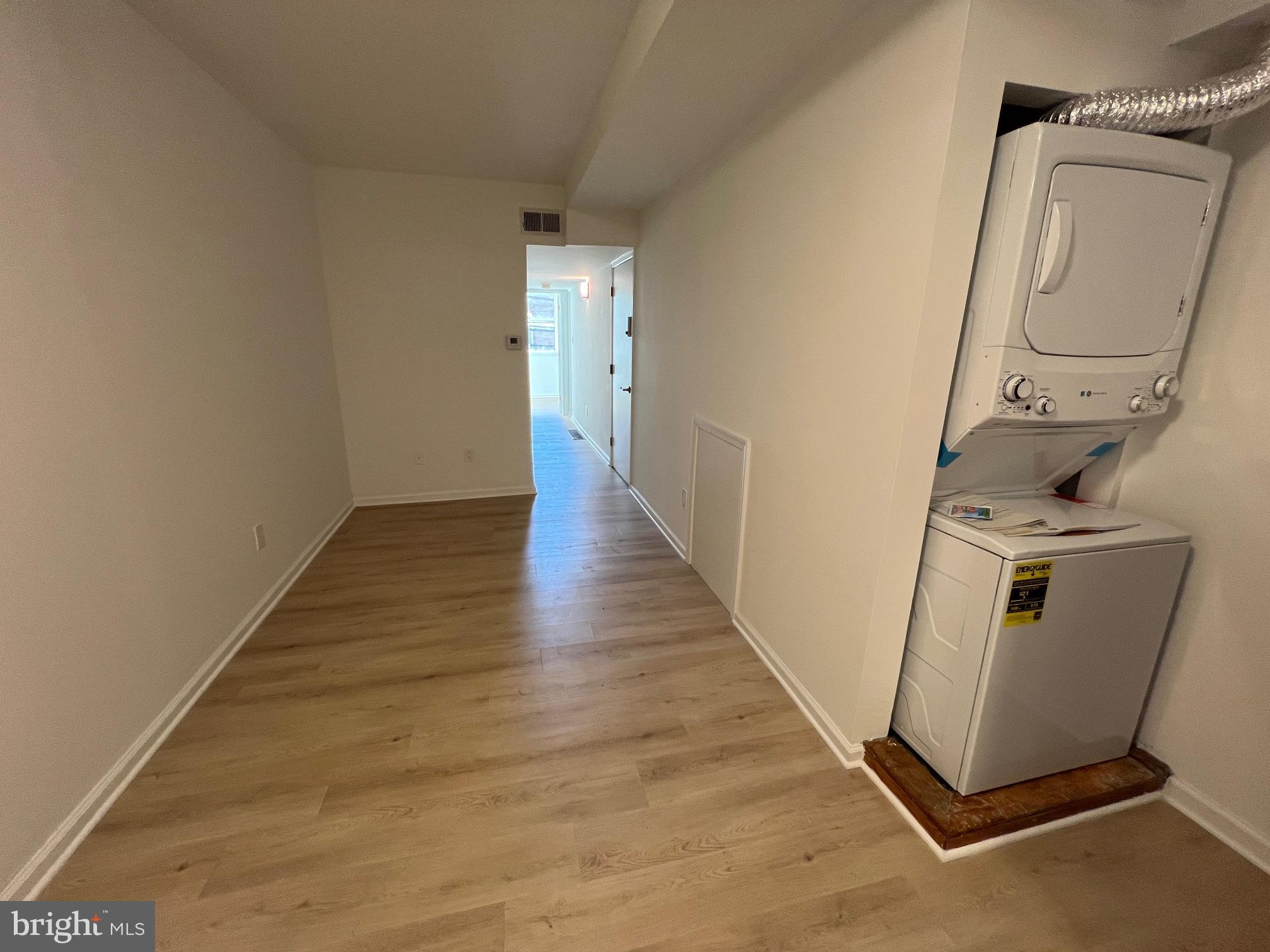 626 South 8th Street, Unit 2 Philadelphia, PA 19147 - Photo 8 of 14 a view of a room with wooden floor and white walls