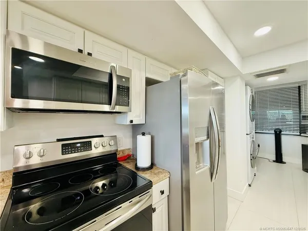 a living room with furniture floor and a flat screen tv