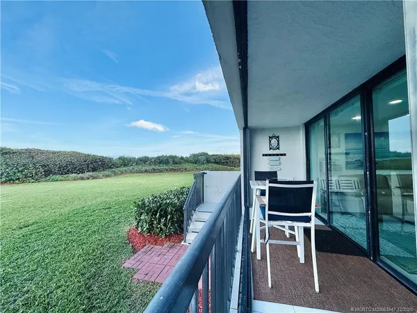 a bathroom with a double vanity sink a mirror and a shower