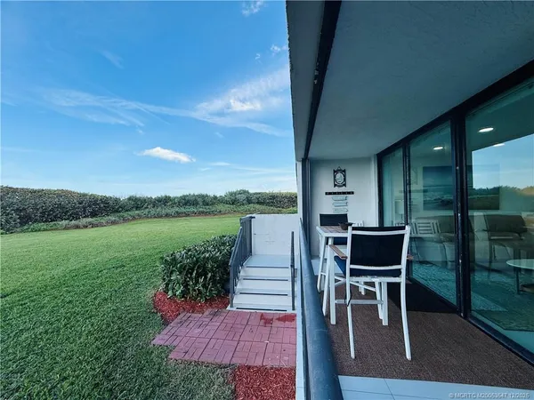 a bathroom with a double vanity sink mirror and bathtub