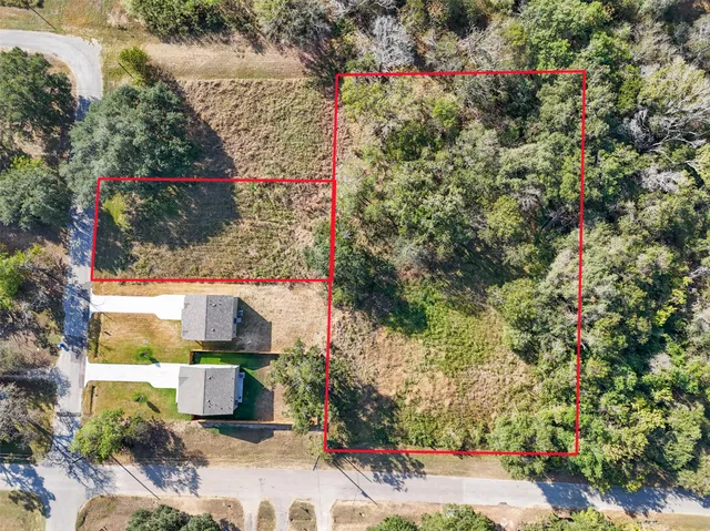 a view of a house with a yard and garden