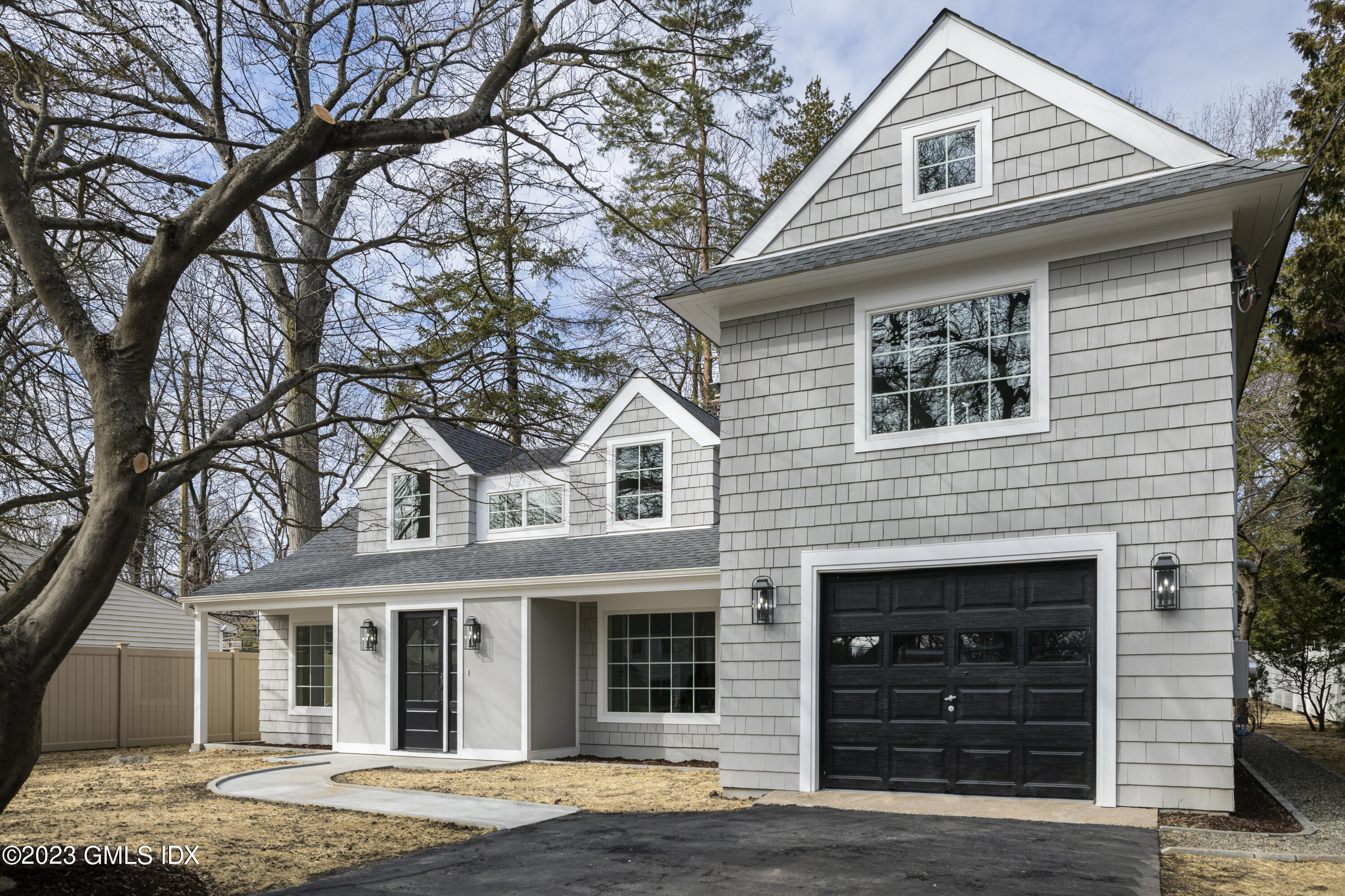 a front view of a house with a garage