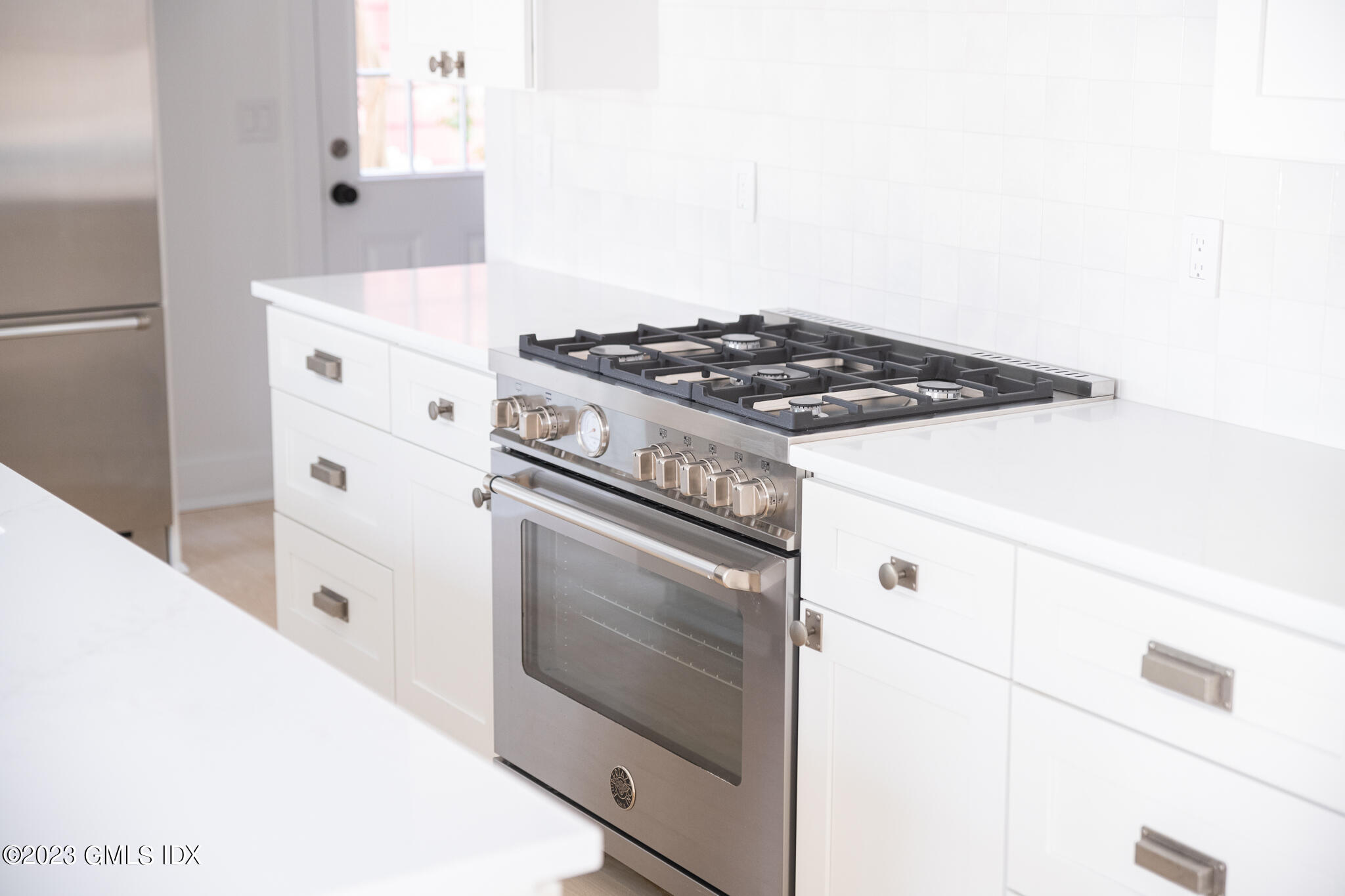 27 Summit Road Riverside, CT 06878 - Photo 11 of 38 a white stove top oven sitting inside of a kitchen