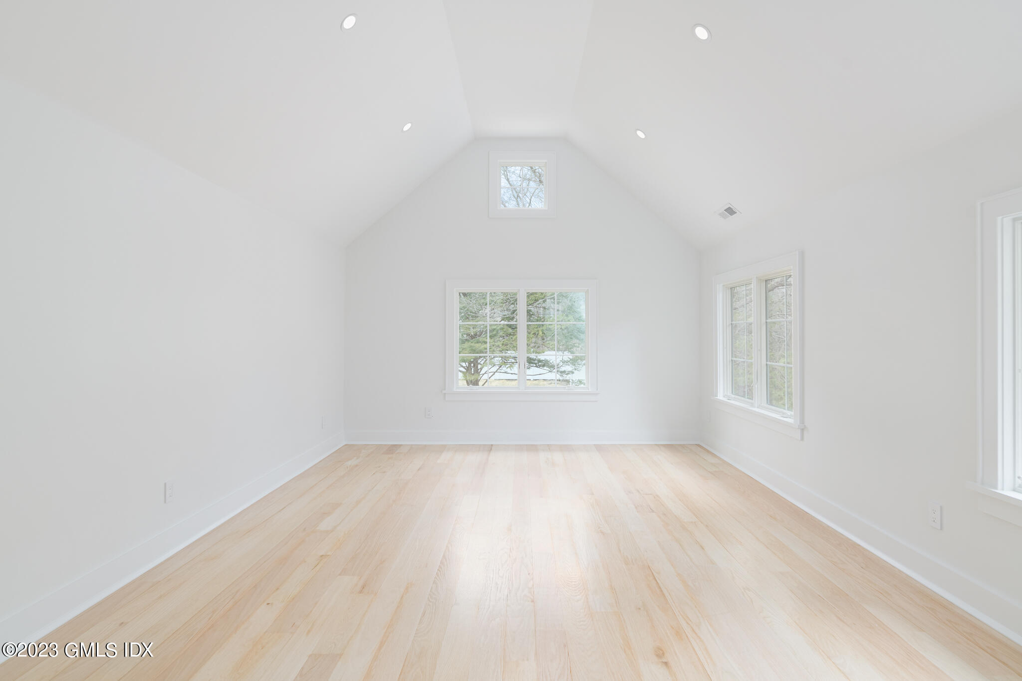 27 Summit Road Riverside, CT 06878 - Photo 17 of 38 an empty room with wooden floor and windows