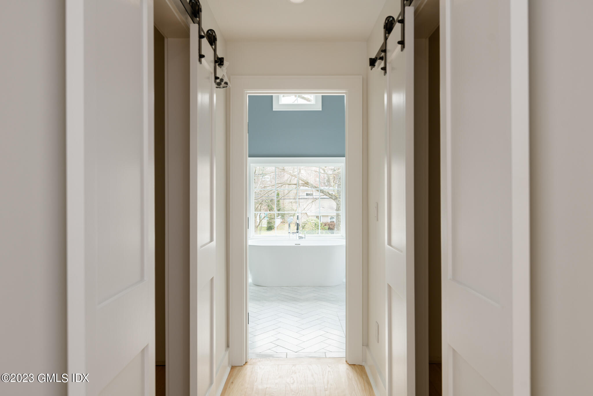 27 Summit Road Riverside, CT 06878 - Photo 18 of 38 a view of a bathroom from a hallway
