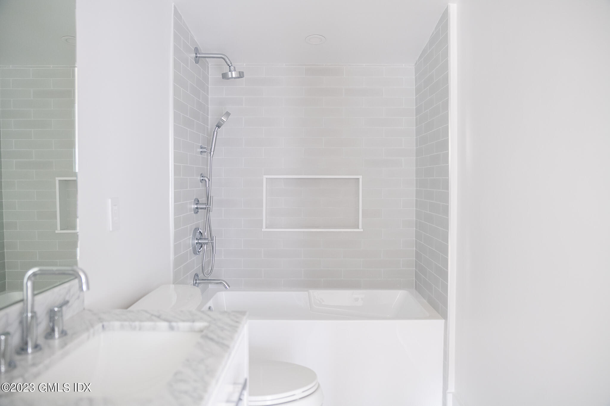27 Summit Road Riverside, CT 06878 - Photo 23 of 38 a bathroom with a granite countertop sink and a mirror