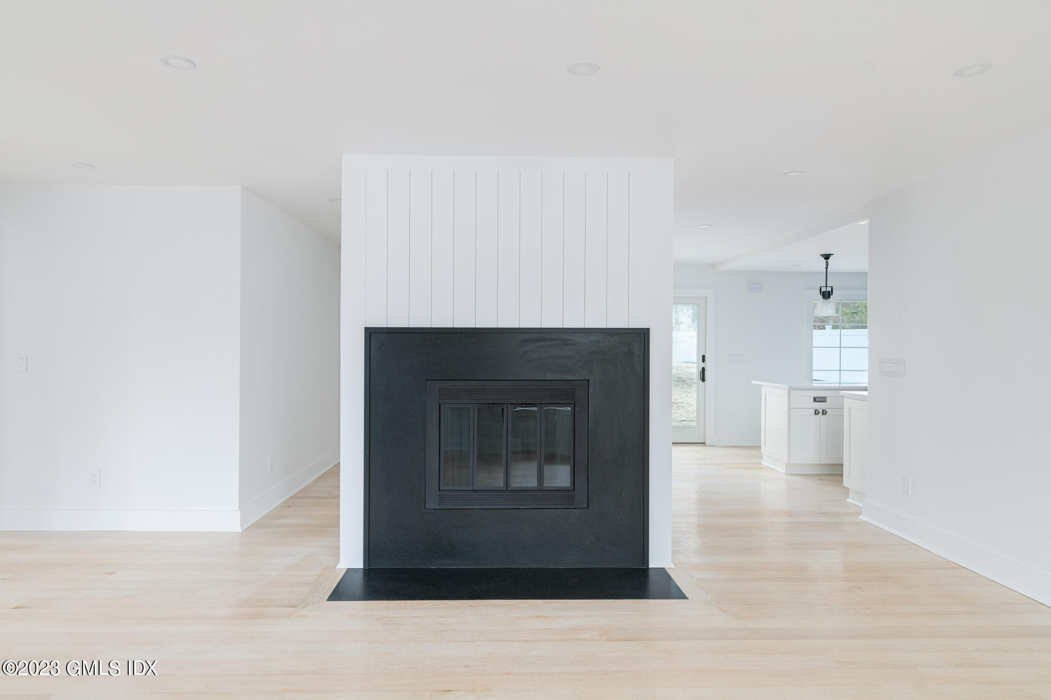 27 Summit Road Riverside, CT 06878 - Photo 6 of 38 a living room with a fireplace and a rug