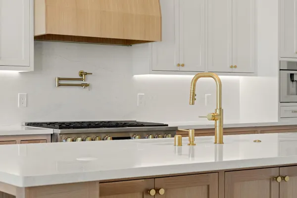 a spacious bathroom with a double vanity sink a large mirror and a bathtub