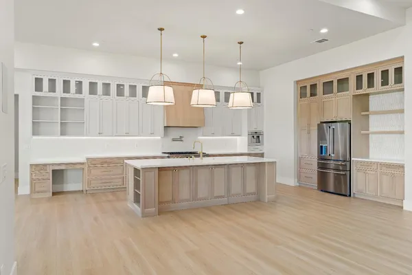 a spacious bathroom with a granite countertop sink mirror and a