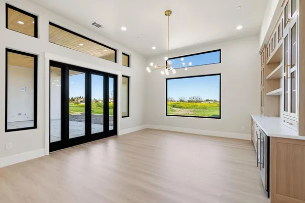 a view of a room with a ceiling fan