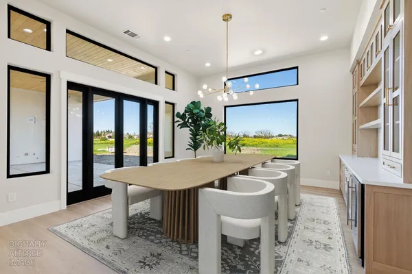 an empty room with windows and air conditioner