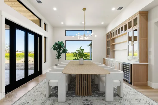 a view of a hallway with a table and chairs
