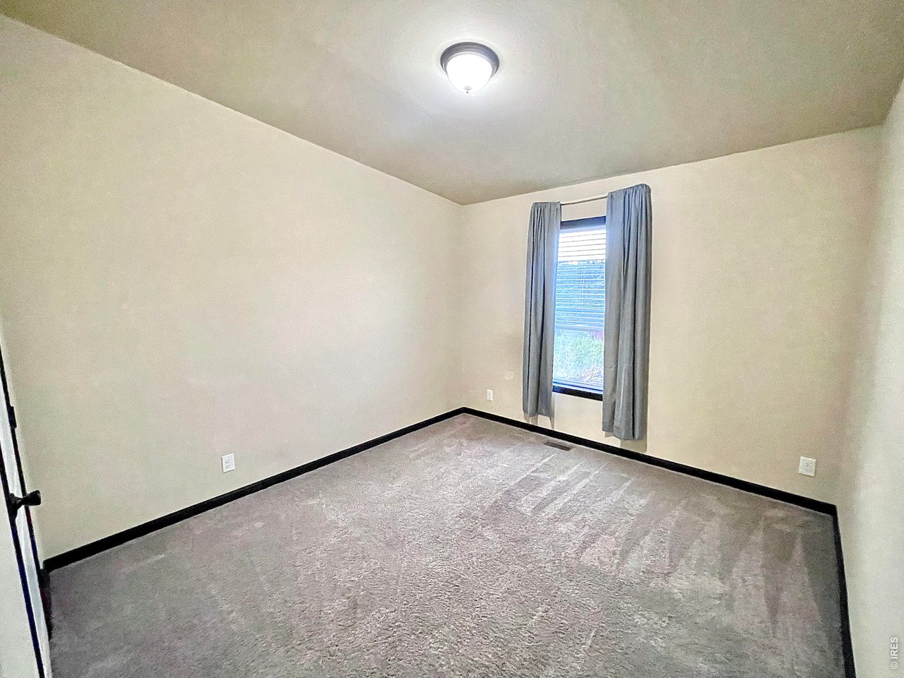 892 Stratton Park Road Bellvue, CO 80512 - Photo 14 of 27 an empty room with a workbench