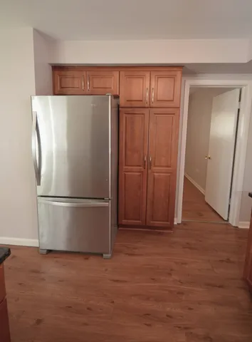 a white refrigerator freezer sitting in a kitchen