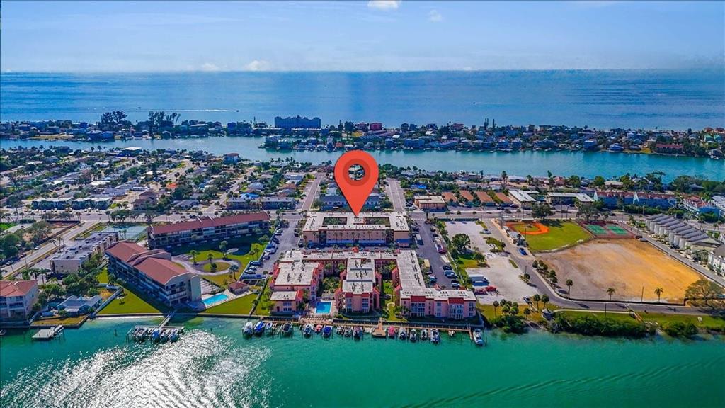8911 Blind Pass Road, Unit 209 St. Pete Beach, FL 33706 - Photo 3 of 21 an aerial view of a and an outdoor space