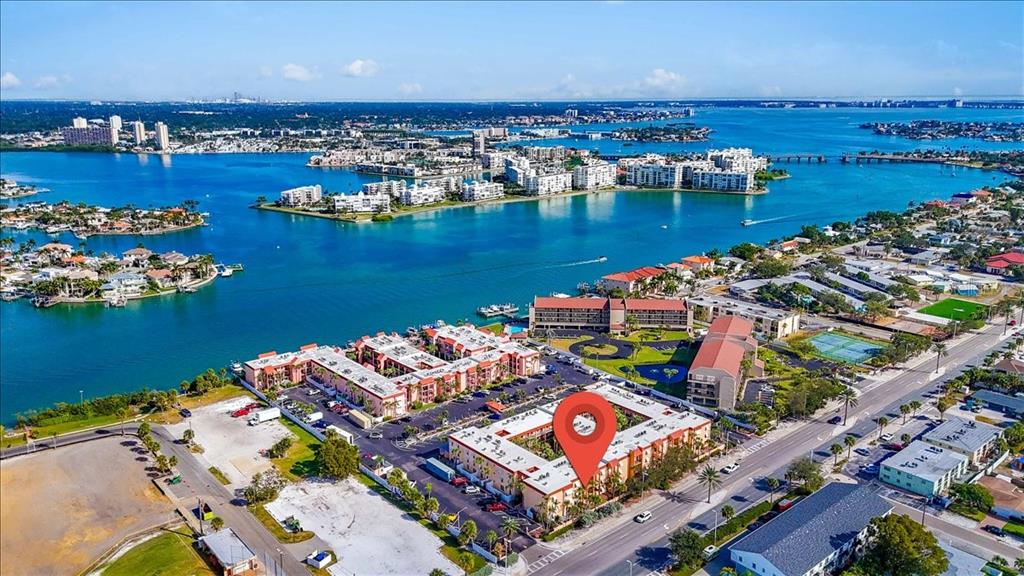 8911 Blind Pass Road, Unit 209 St. Pete Beach, FL 33706 - Photo 4 of 21 an aerial view of a city with an ocean view