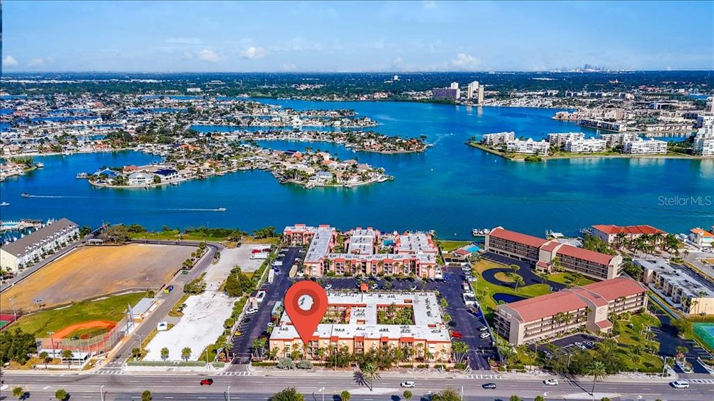 8911 Blind Pass Road, Unit 209 St. Pete Beach, FL 33706 - Photo 5 of 21 an aerial view of a house with a ocean view