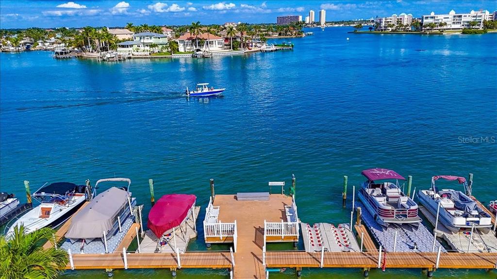 8911 Blind Pass Road, Unit 209 St. Pete Beach, FL 33706 - Photo 8 of 21 an aerial view of residential houses with outdoor space