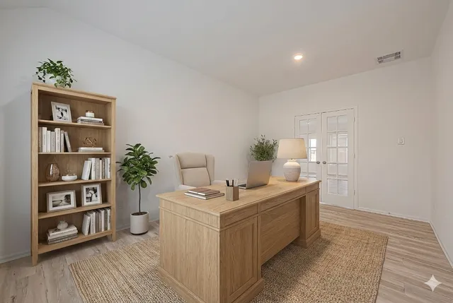 a room with furniture and wooden floor