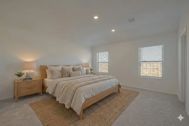 a bedroom with a bed and window