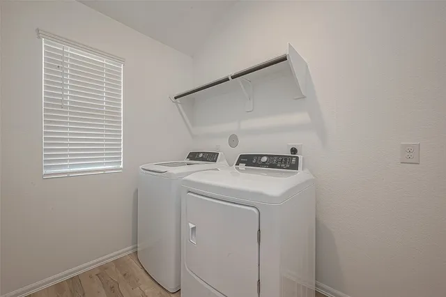 a utility room with dryer and washer